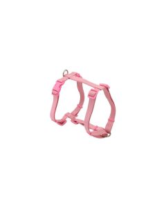 Vista lateral del arnés Nayeco Basic en H rosa de nylon con anillas metálicas y cierres plásticos
