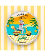 Harper's Gelato sabor banana para perros, envase amarillo con ilustración de perro en scooter, helado cremoso y refrescante de venta en Zona K9.