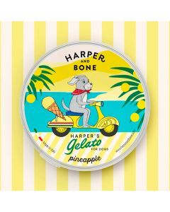 Envase redondo amarillo de helado para perros Harper and Bone sabor pi&ntilde;a con ilustraci&oacute;n de perro en scooter.
