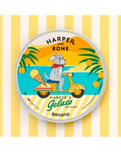 Harper's Gelato sabor banana para perros, envase amarillo con ilustraci&oacute;n de perro en scooter, helado cremoso y refrescante de venta en Zona K9.